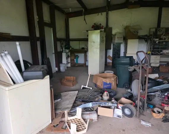 Garage and shop full of junk before cleanup